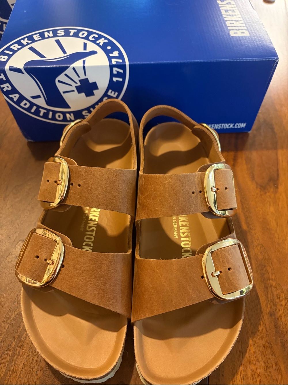 Birkenstock “Milano” Tan Leather Two-Strap Sandals with Gold Buckles